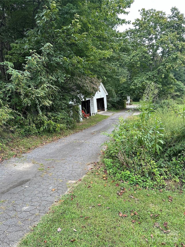 view of street with aphalt driveway