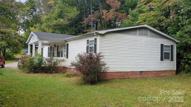 view of home's exterior featuring crawl space and a yard