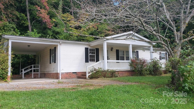 view of front facade featuring a carport, a front yard, crawl space, and covered porch