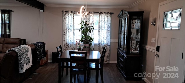 dining area featuring crown molding and dark wood-type flooring