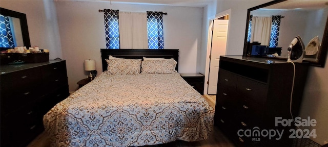 bedroom featuring wood-type flooring