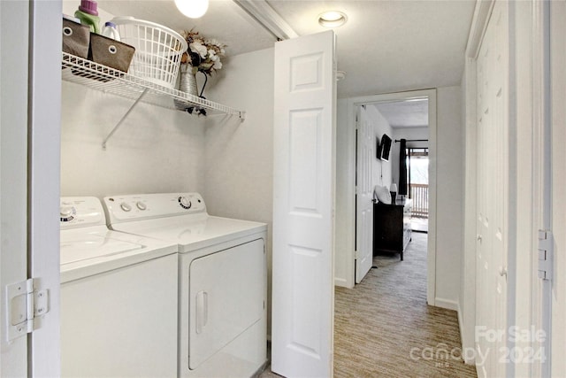 laundry room featuring separate washer and dryer