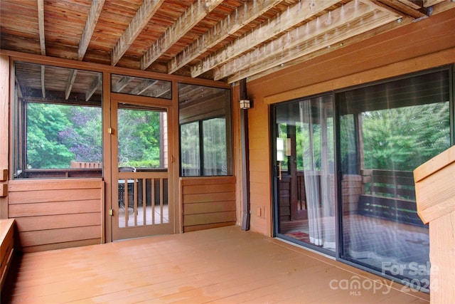 unfurnished sunroom featuring a healthy amount of sunlight