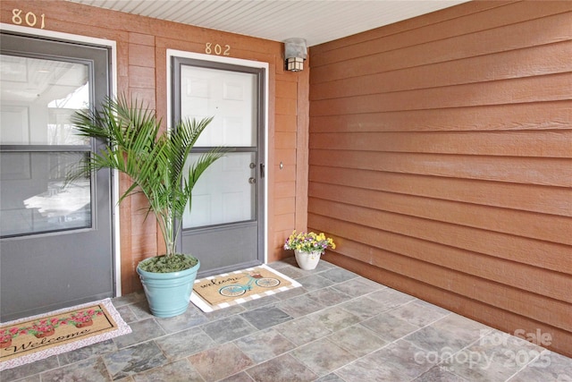 property entrance featuring covered porch