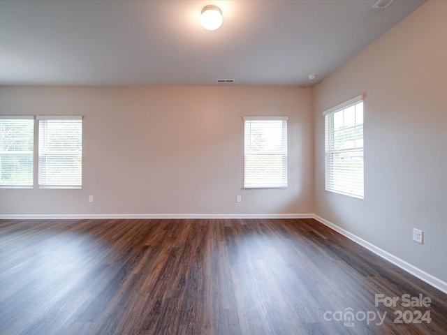 empty room featuring dark hardwood / wood-style floors