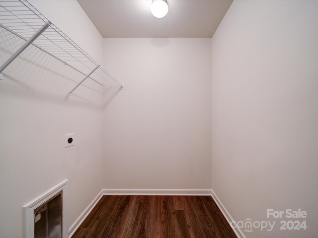 clothes washing area featuring hardwood / wood-style floors and hookup for an electric dryer