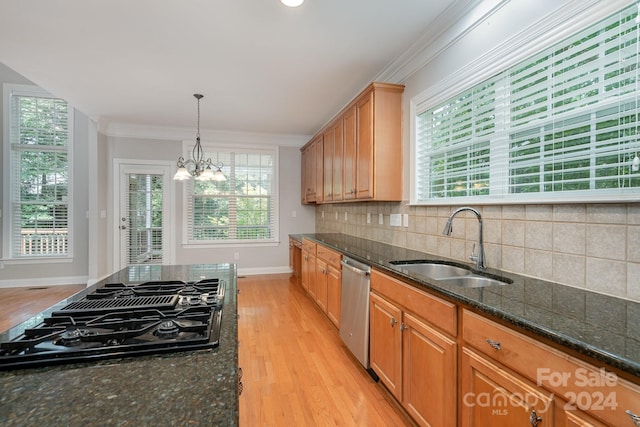 kitchen with black gas stovetop, dark stone countertops, sink, and light hardwood / wood-style flooring