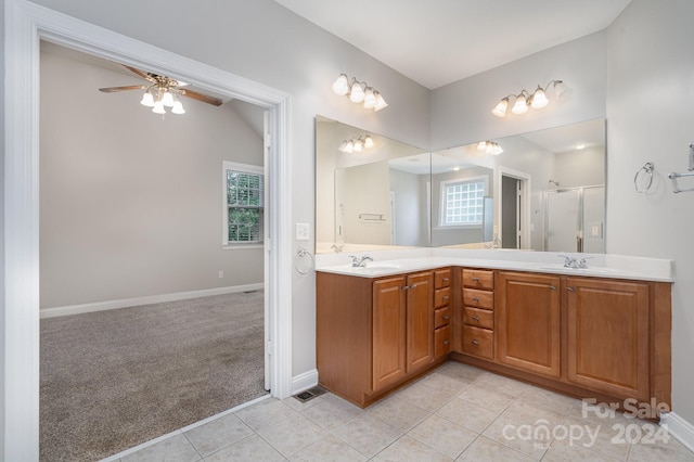 bathroom featuring vanity, ceiling fan, tile patterned floors, and a shower with shower door