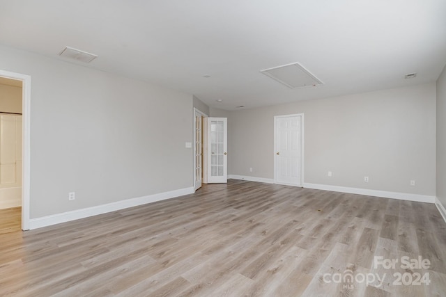 empty room with light wood-type flooring