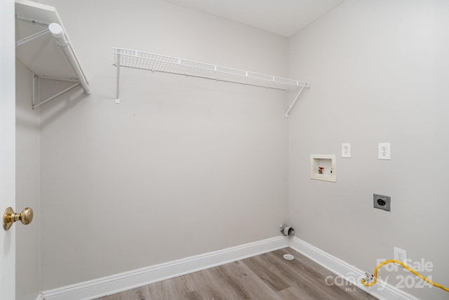 laundry area with washer hookup, hardwood / wood-style floors, and electric dryer hookup