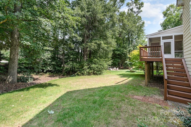 view of yard with a deck