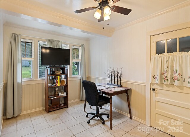 office featuring wainscoting, ceiling fan, crown molding, and light tile patterned flooring