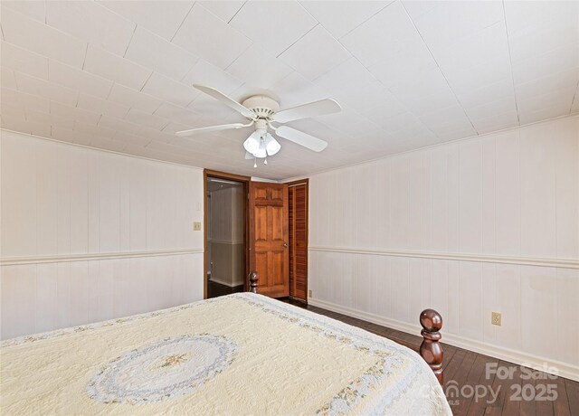 bedroom featuring a ceiling fan and wood finished floors