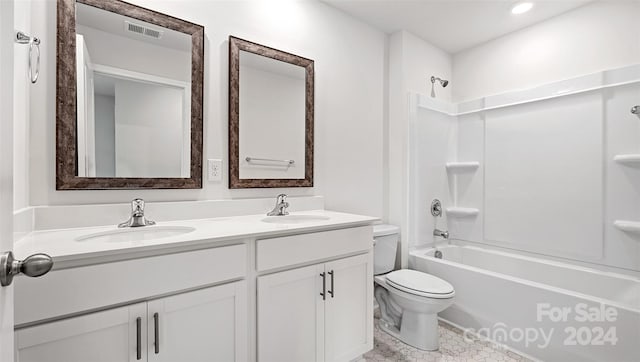 full bathroom with vanity, tile patterned flooring, toilet, and washtub / shower combination