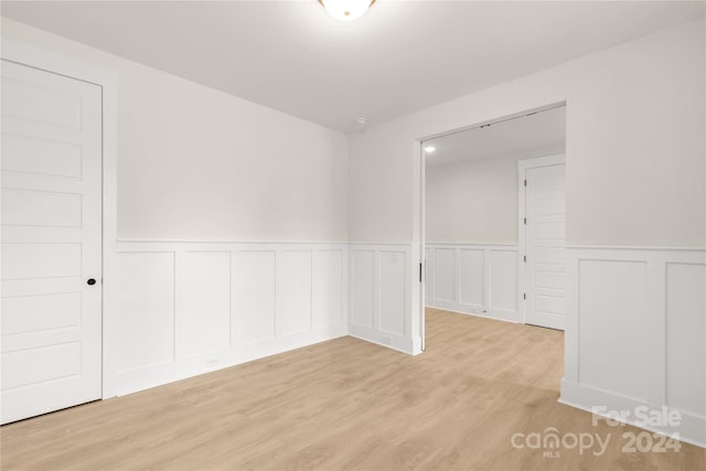 unfurnished room featuring light wood-type flooring