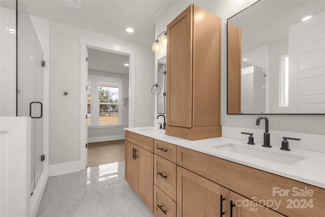 bathroom with vanity and an enclosed shower