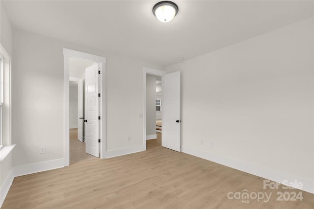 unfurnished bedroom featuring light wood-type flooring