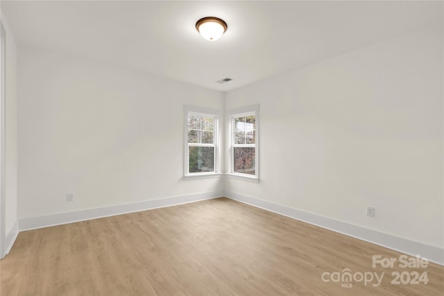 spare room featuring light hardwood / wood-style flooring