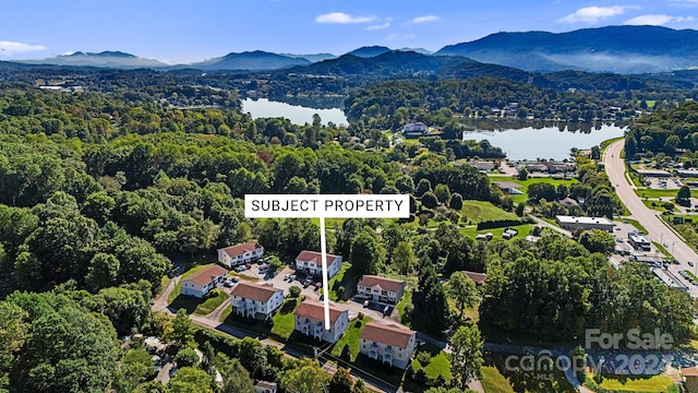 bird's eye view with a water and mountain view