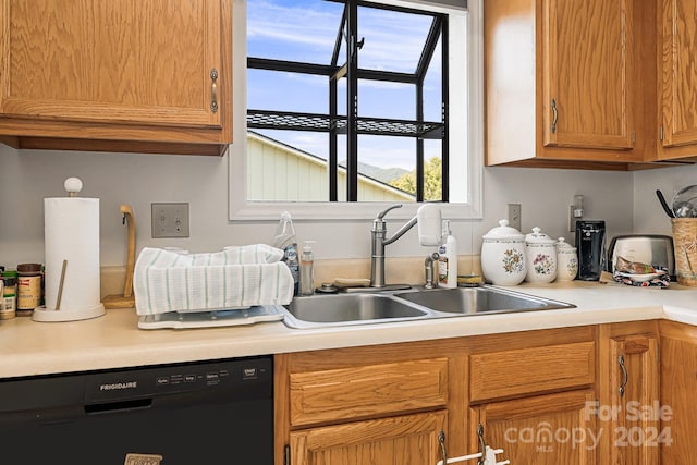 kitchen featuring black dishwasher and sink