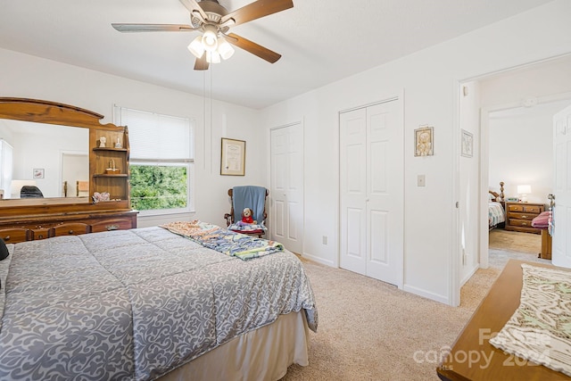 bedroom with light carpet and ceiling fan