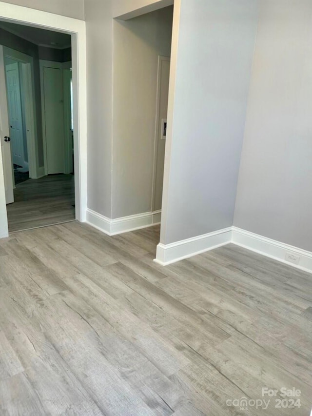 spare room featuring light hardwood / wood-style flooring