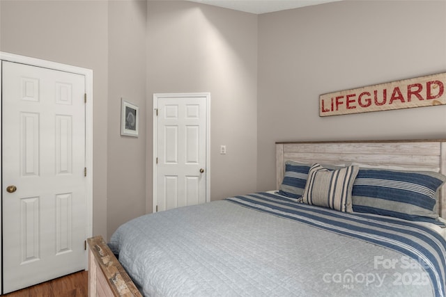 bedroom with hardwood / wood-style flooring