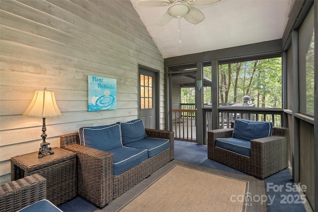 sunroom / solarium featuring ceiling fan and lofted ceiling