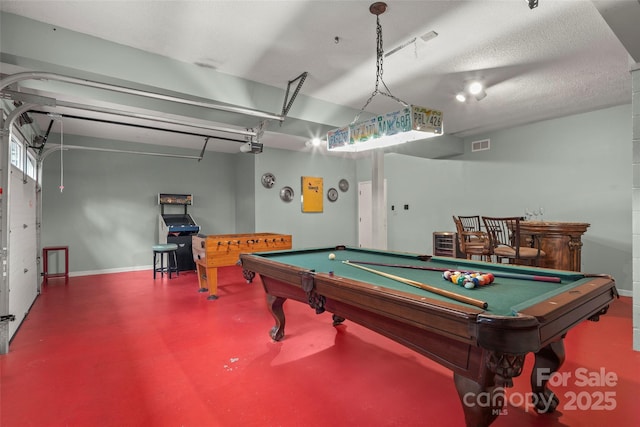 rec room with billiards and concrete floors