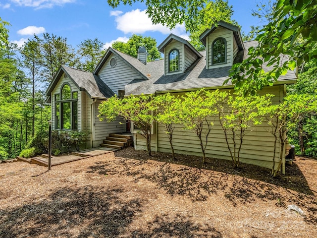 212 Ridgeway Rd, Lake Lure, NC 28746 - view of front of house with roof with shingles and a chimney