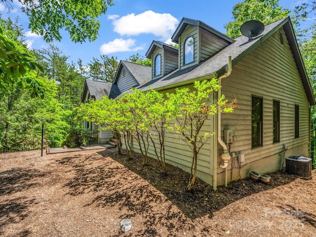 212 Ridgeway Rd, Lake Lure, NC 28746 - view of home's exterior featuring central AC unit and roof with shingles