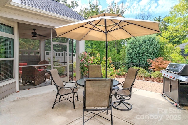 view of patio with area for grilling and ceiling fan