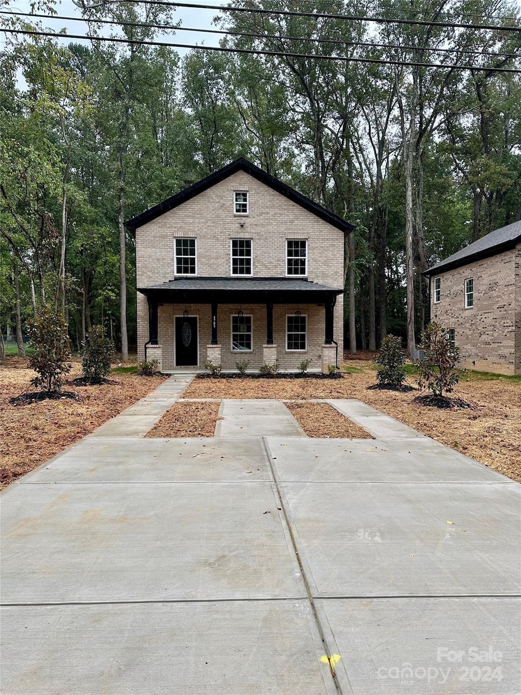 view of front property featuring covered porch