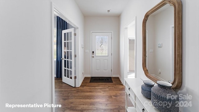 doorway with dark hardwood / wood-style flooring