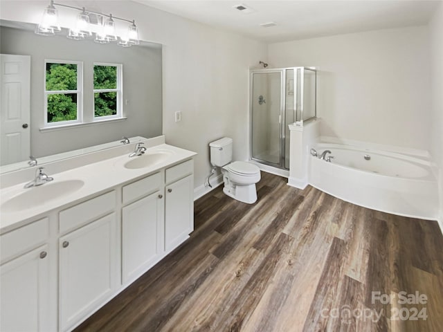 full bathroom featuring vanity, plus walk in shower, toilet, and hardwood / wood-style flooring