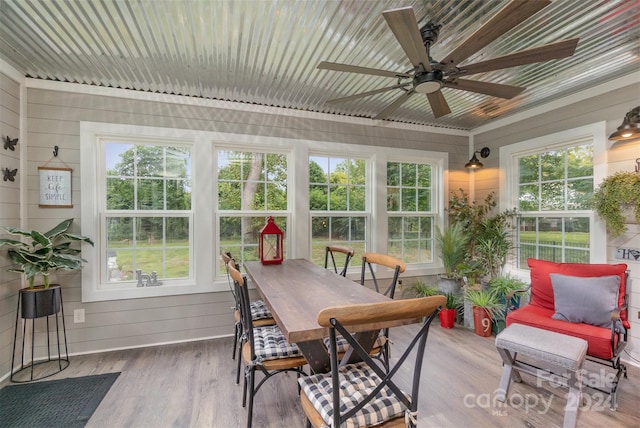 sunroom with ceiling fan and a healthy amount of sunlight