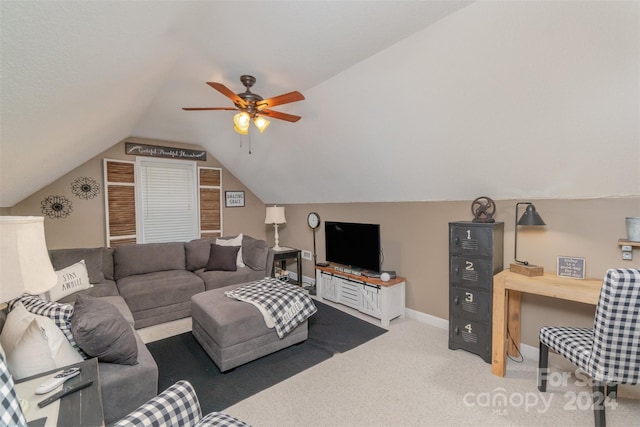 living room with ceiling fan, lofted ceiling, and carpet