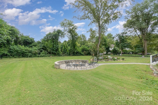 view of yard with a patio and a fire pit