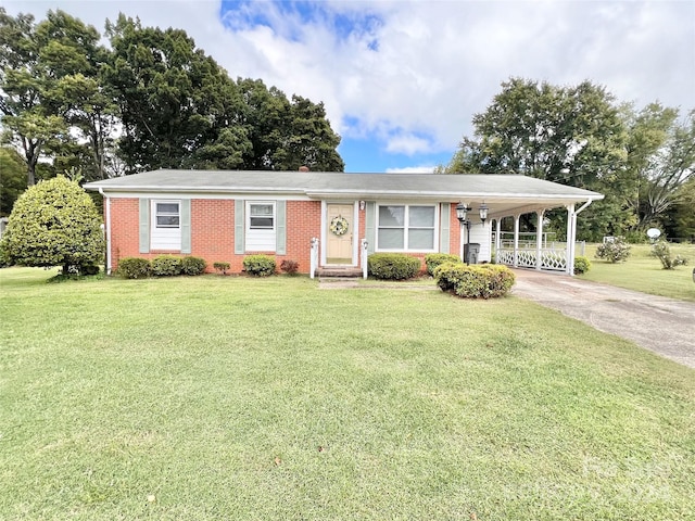 ranch-style house with a front lawn and a carport