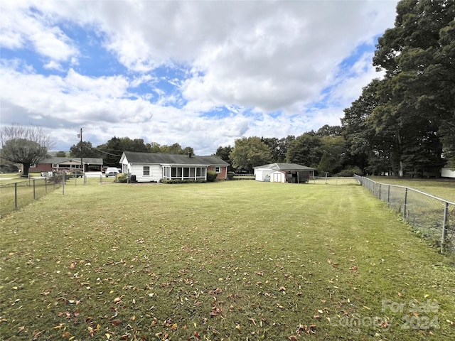 view of yard with a rural view