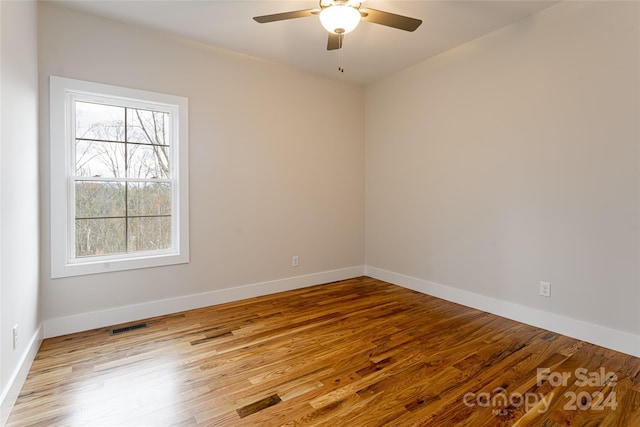 unfurnished room featuring ceiling fan and light hardwood / wood-style flooring