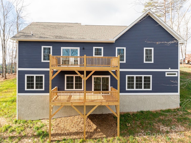 back of property with a wooden deck