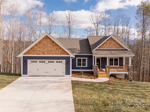 craftsman house featuring a front lawn, covered porch, and a garage