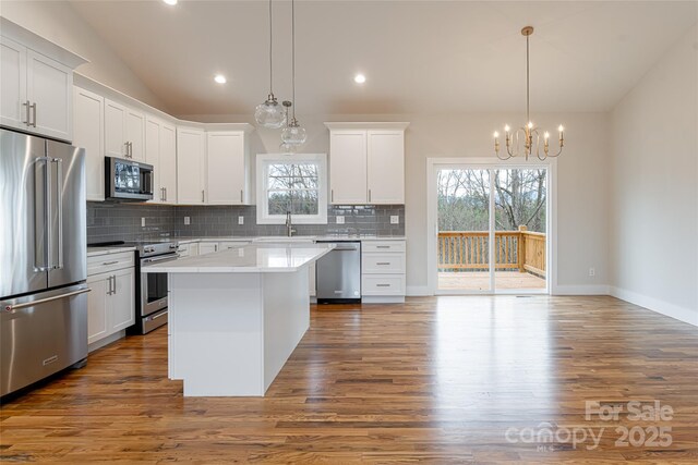 224 Country Dr, Mars Hill, NC 28754 - kitchen featuring stainless steel appliances, healthy amount of natural light, tasteful backsplash, dark wood-style floors, and recessed lighting