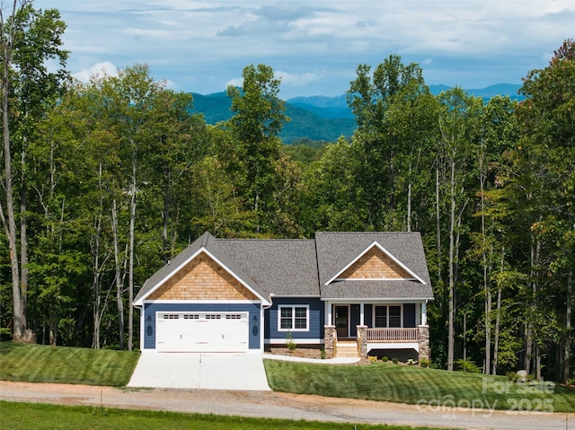 224 Country Dr, Mars Hill, NC 28754 - craftsman-style home featuring a garage, a porch, a front lawn, driveway, and a shingled roof