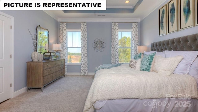 carpeted bedroom featuring multiple windows, ornamental molding, and a raised ceiling