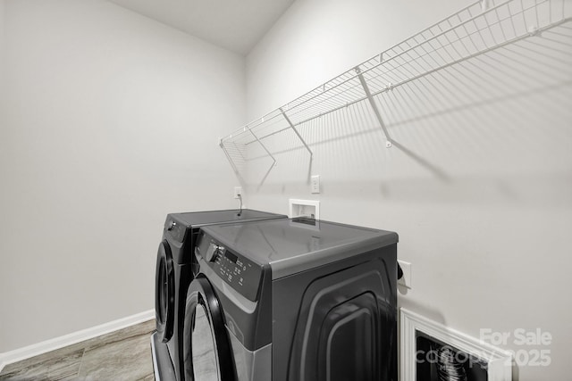 laundry area featuring washing machine and clothes dryer