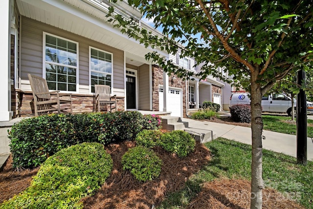 view of front of house with covered porch and a garage