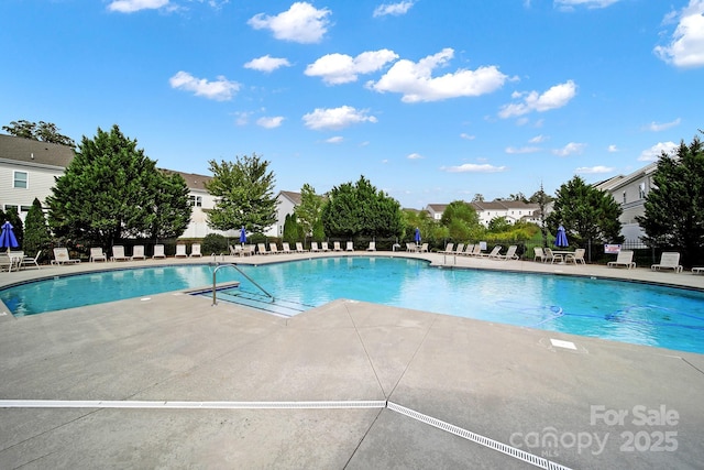 view of pool featuring a patio area