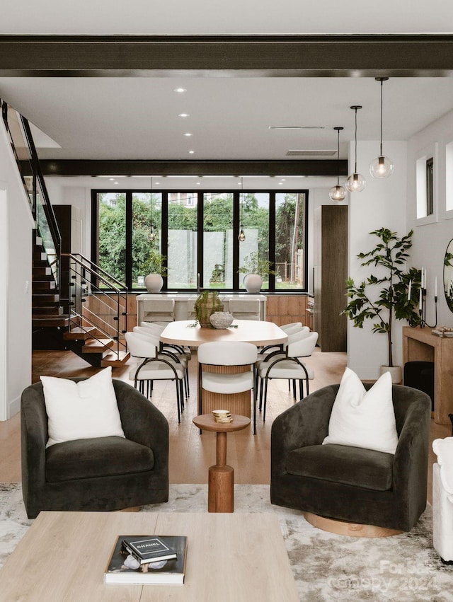 living room with a wealth of natural light and wood-type flooring